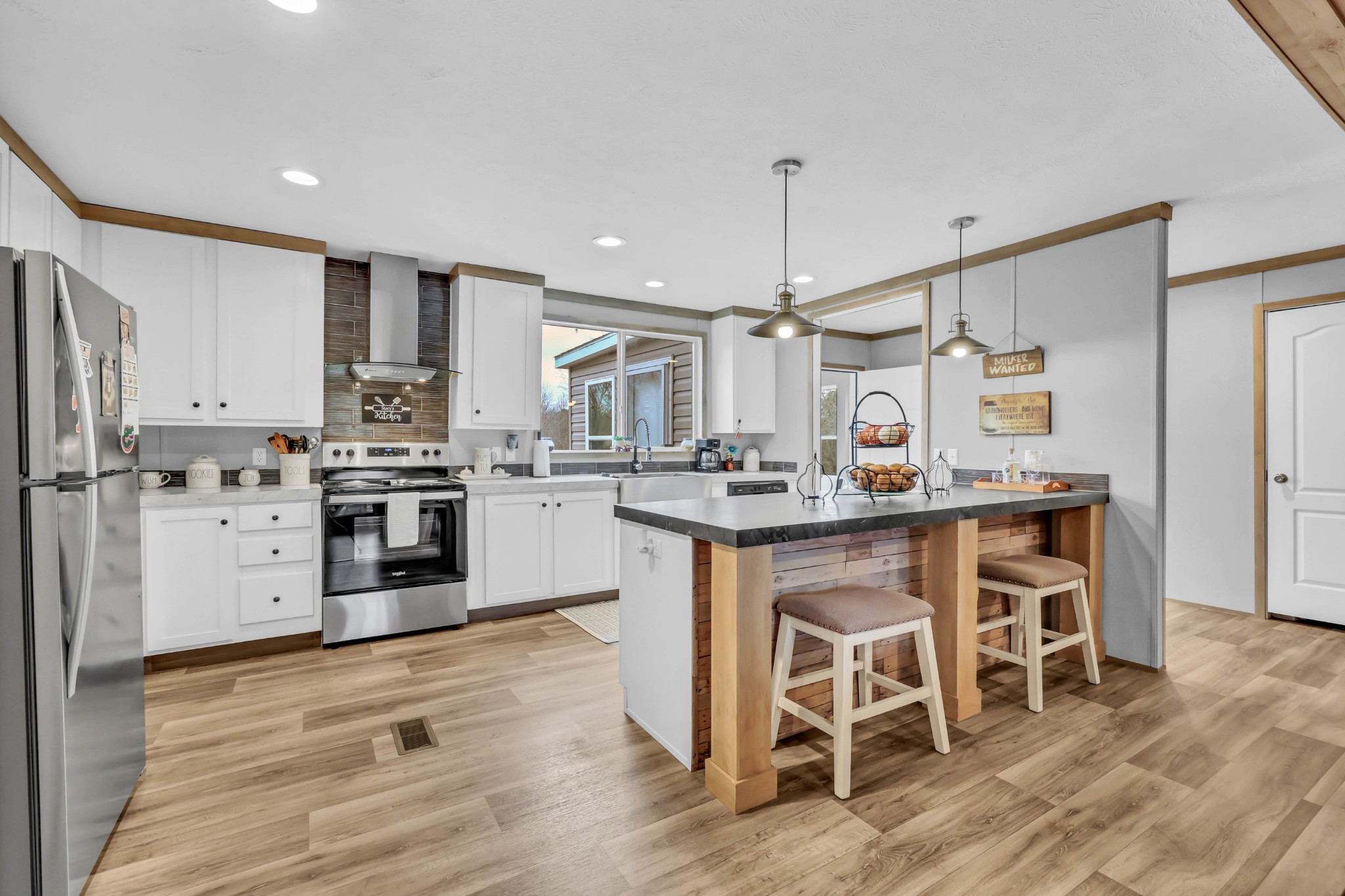 124 Old Lafayette Road Big Rock, TN 37023 - Photo 37 of 62 a kitchen with white cabinets and stainless steel appliances