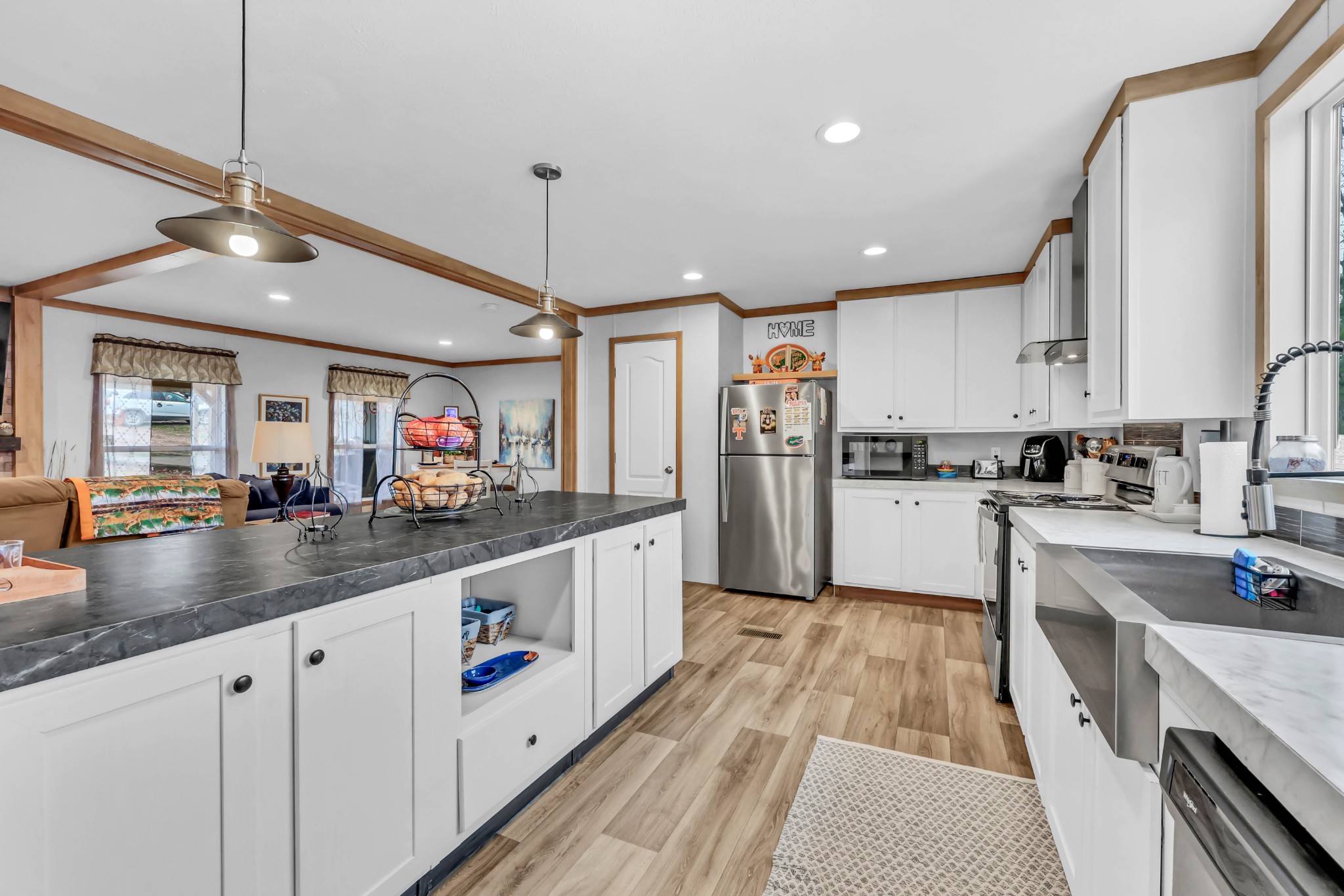 124 Old Lafayette Road Big Rock, TN 37023 - Photo 38 of 62 a large kitchen with stainless steel appliances kitchen island granite countertop a sink and cabinets