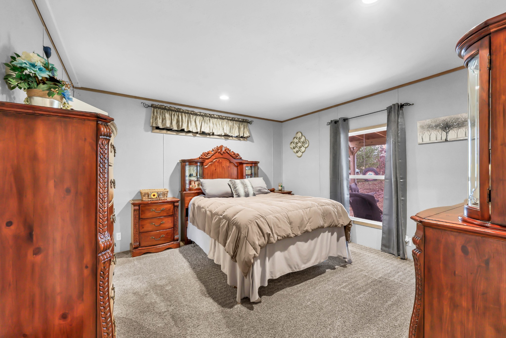 124 Old Lafayette Road Big Rock, TN 37023 - Photo 40 of 62 a spacious bedroom with a bed and a flat screen tv