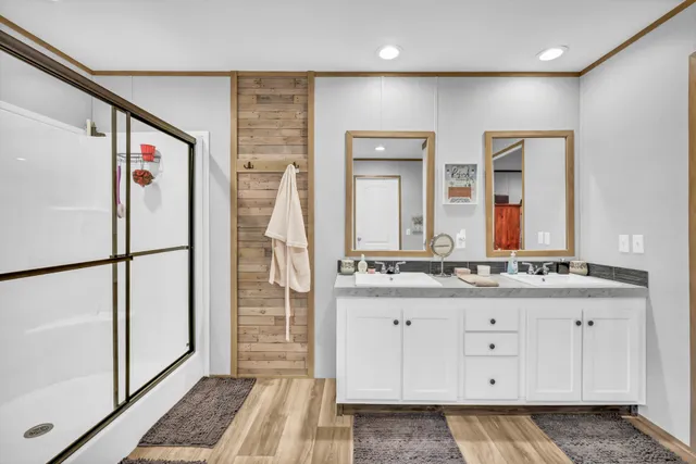 a view of a livingroom with wooden floor and furniture