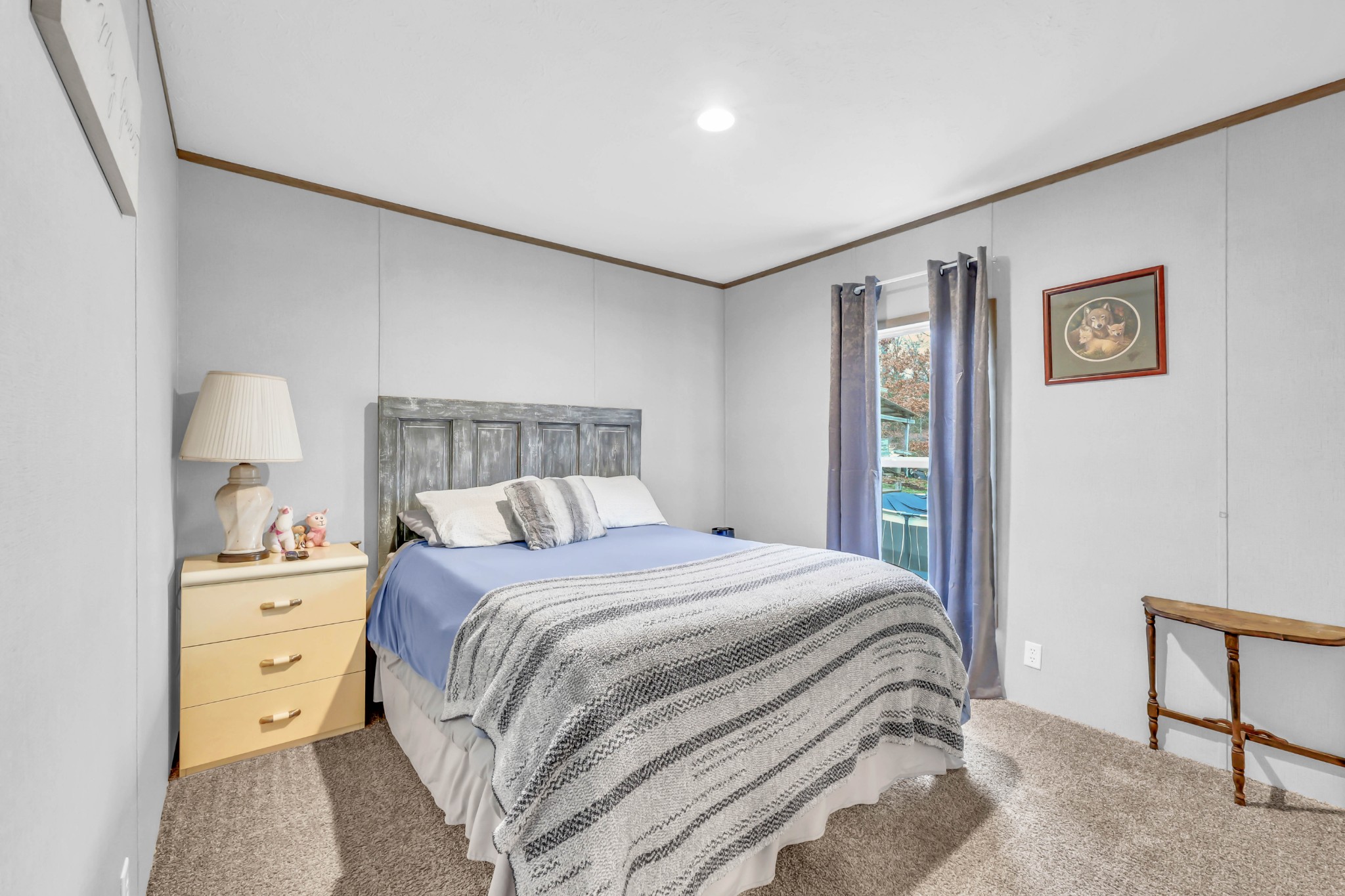 124 Old Lafayette Road Big Rock, TN 37023 - Photo 46 of 62 a bedroom with a bed and a lamp on dresser