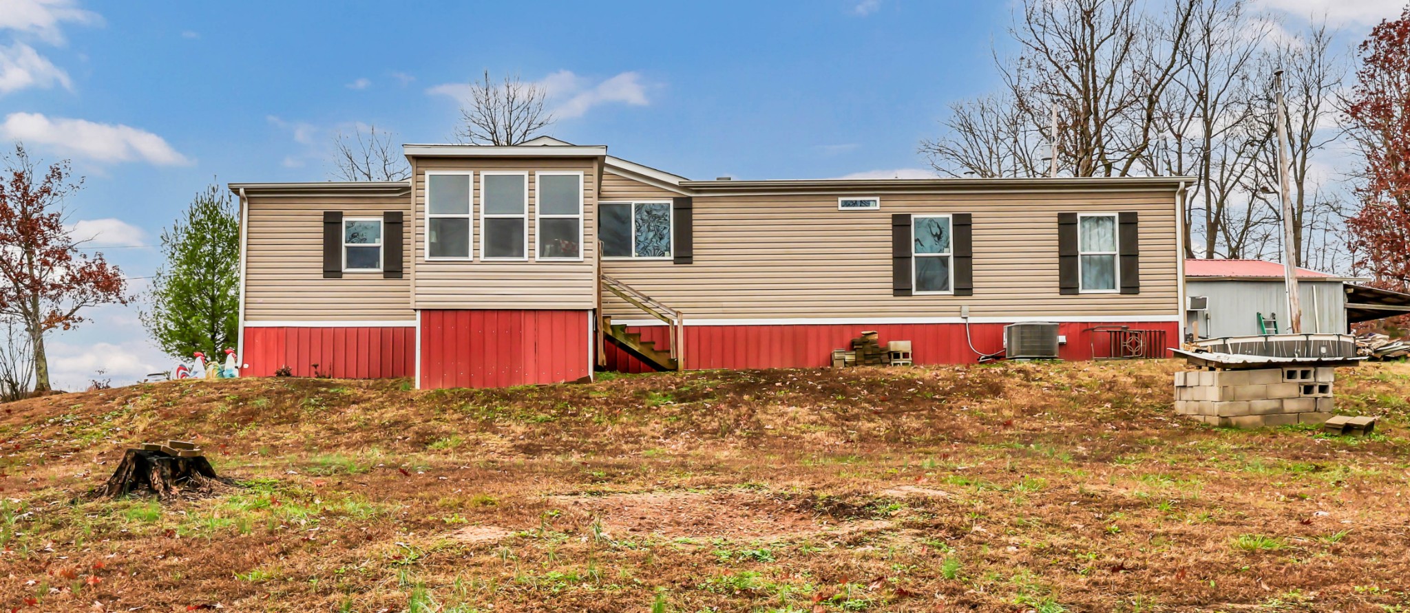 124 Old Lafayette Road Big Rock, TN 37023 - Photo 57 of 62 a front view of a house with a yard and garage
