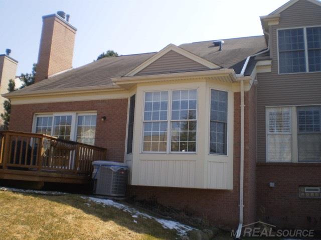 1923 Dunham Drive, Unit 90 Rochester, MI 48306 - Photo 24 of 27 Rear Elevation 1