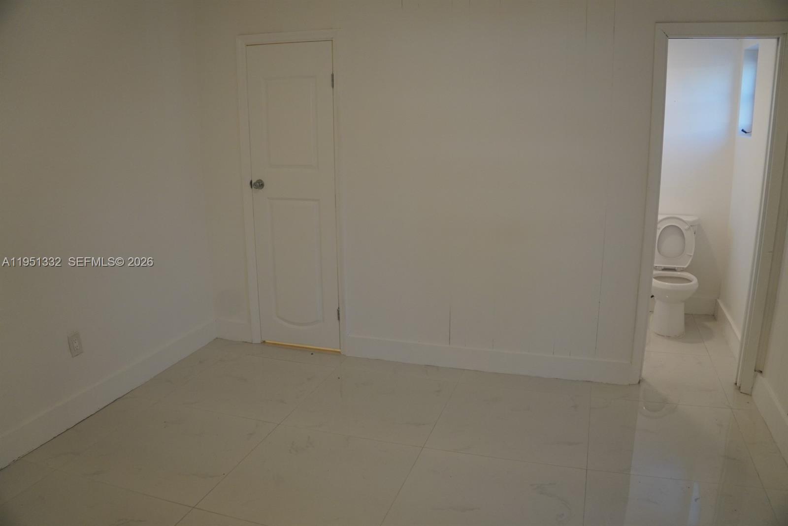 61 Southwest 58th Court, Unit D Miami, FL 33144 - Photo 5 of 7 close up of a white marble wall