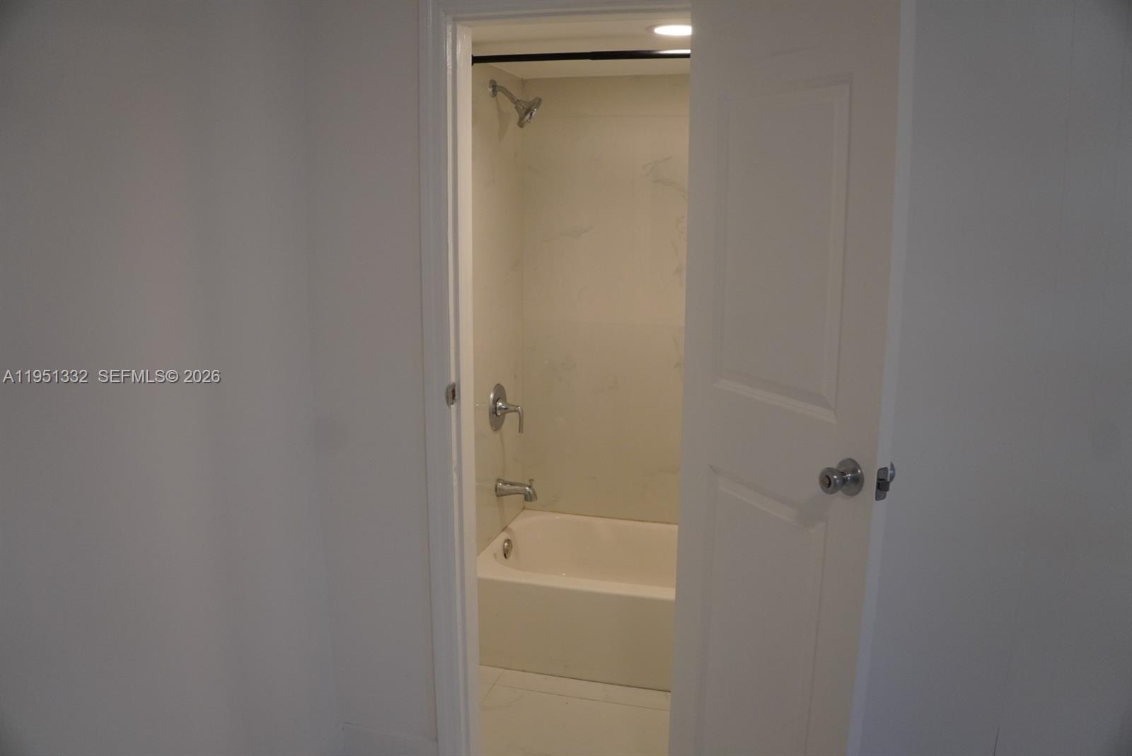 61 Southwest 58th Court, Unit D Miami, FL 33144 - Photo 6 of 7 a bathroom with a shower