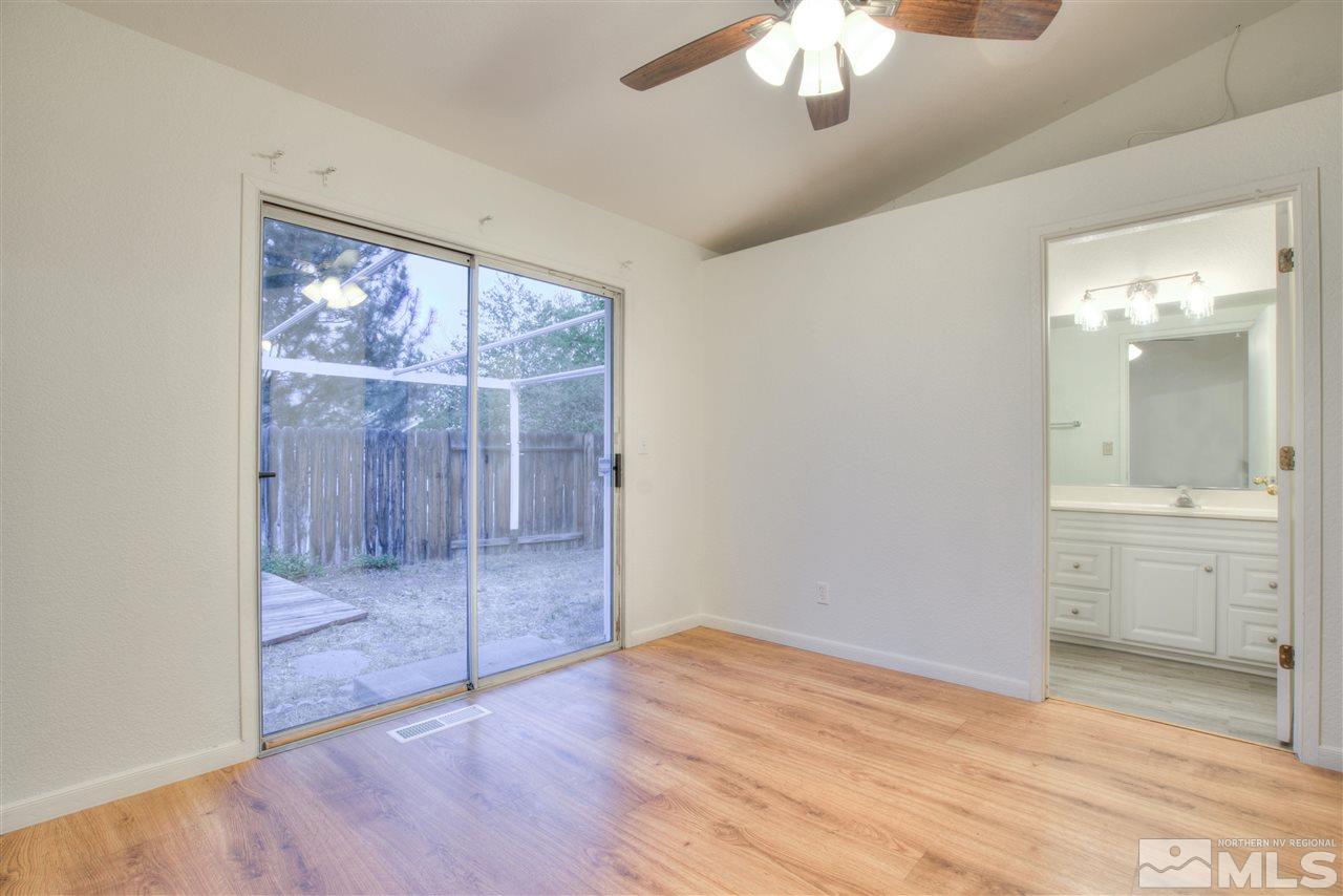 7553 Water View Way Reno, NV 89511 - Photo 24 of 31 wooden floor in an empty room with a window