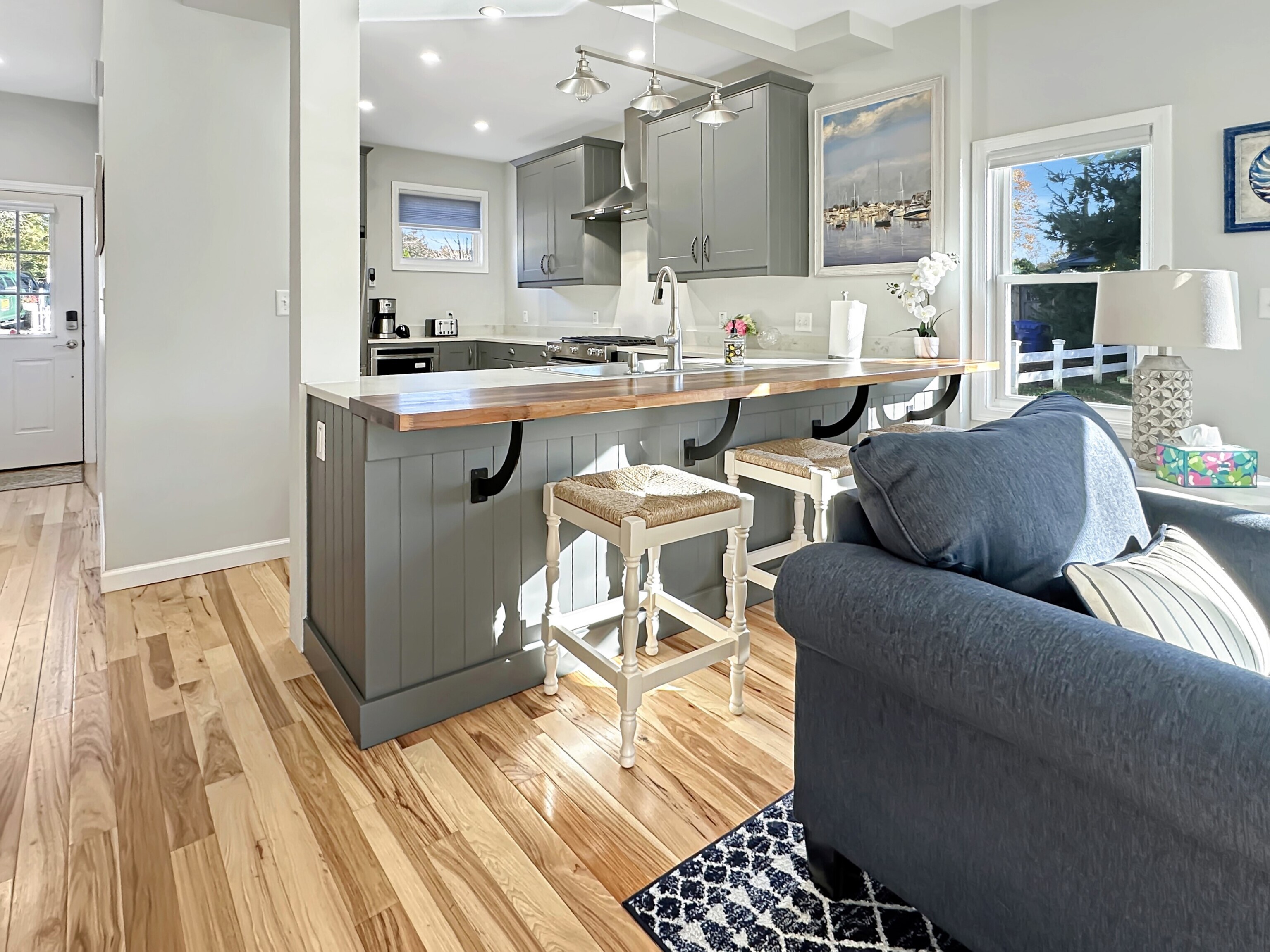 276 Niantic River Road Waterford, CT 06385 - Photo 18 of 40 a living room with furniture a wooden floor and a rug