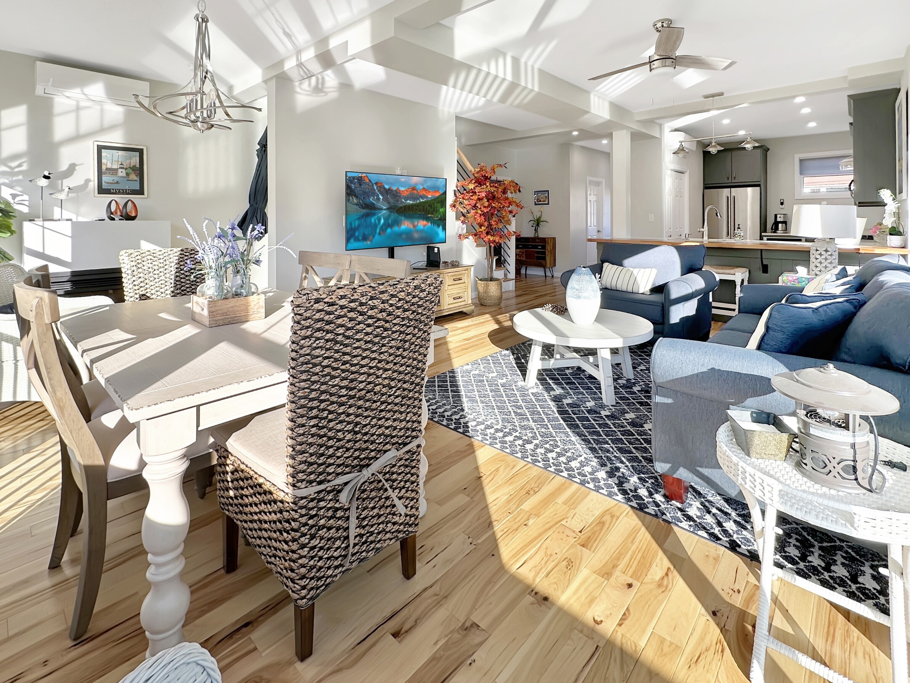 276 Niantic River Road Waterford, CT 06385 - Photo 22 of 40 a living room with fireplace furniture and a chandelier