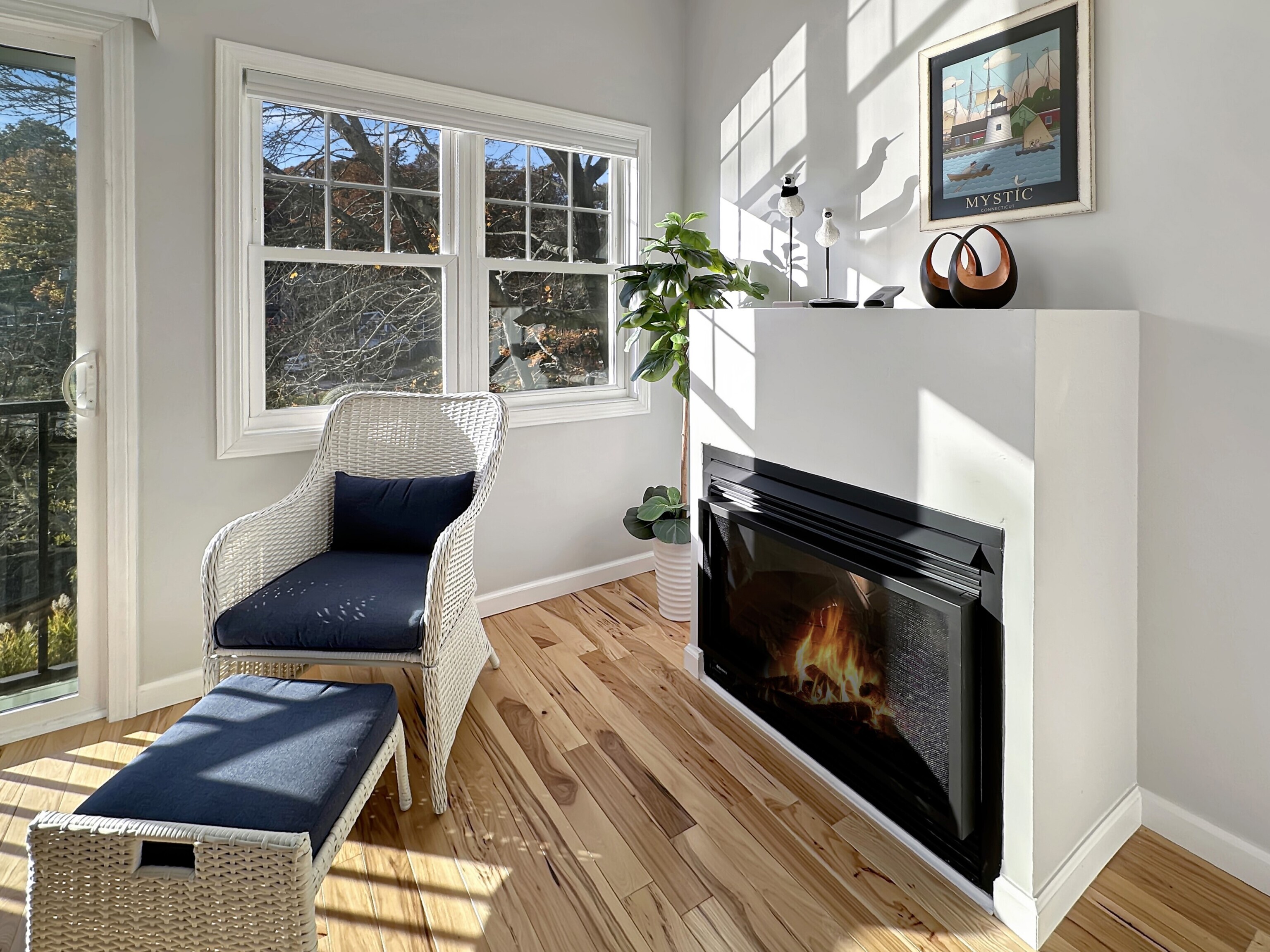 276 Niantic River Road Waterford, CT 06385 - Photo 23 of 40 a living room with furniture and a fireplace