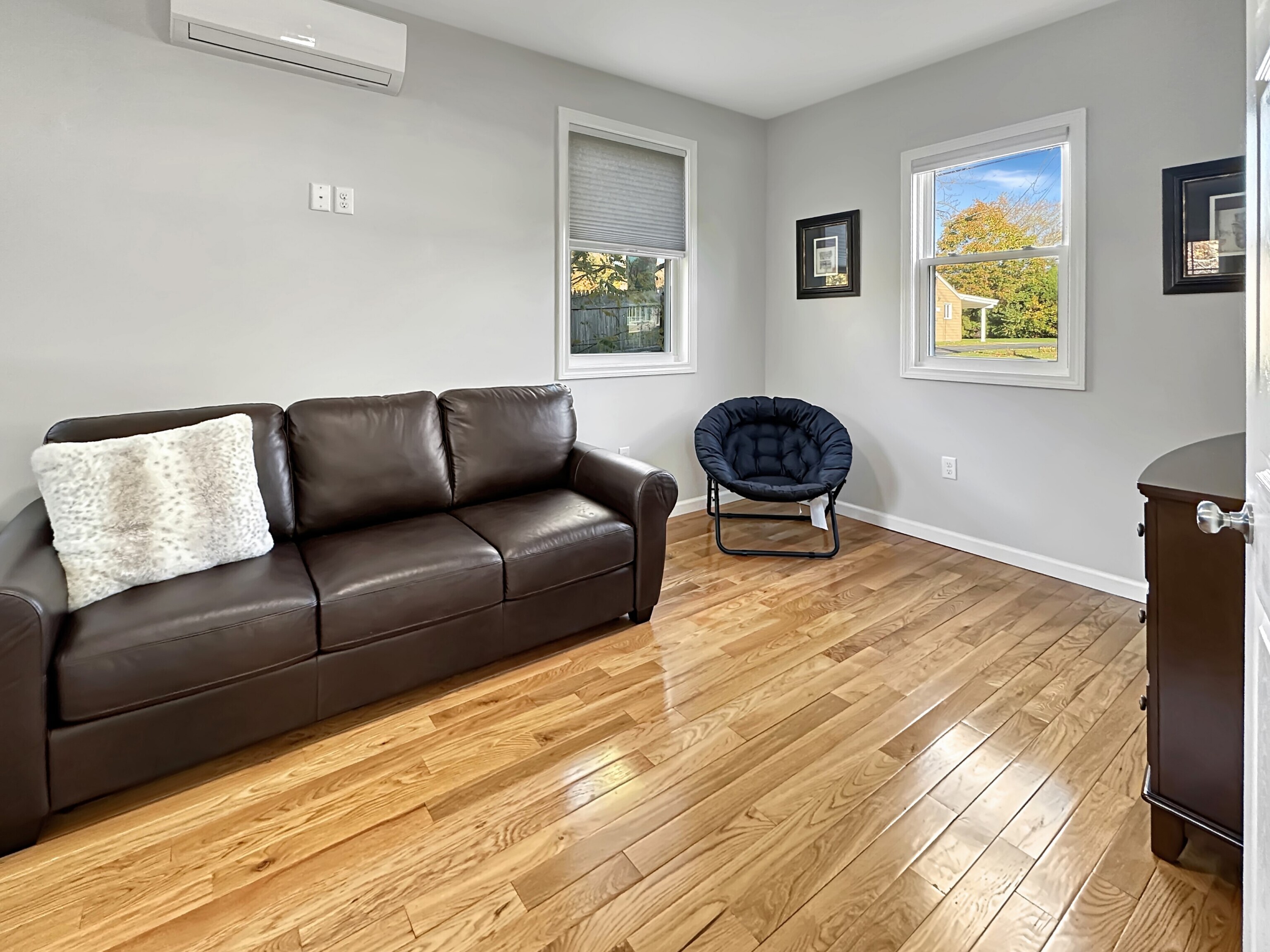 276 Niantic River Road Waterford, CT 06385 - Photo 24 of 40 a living room with furniture and a wooden floor
