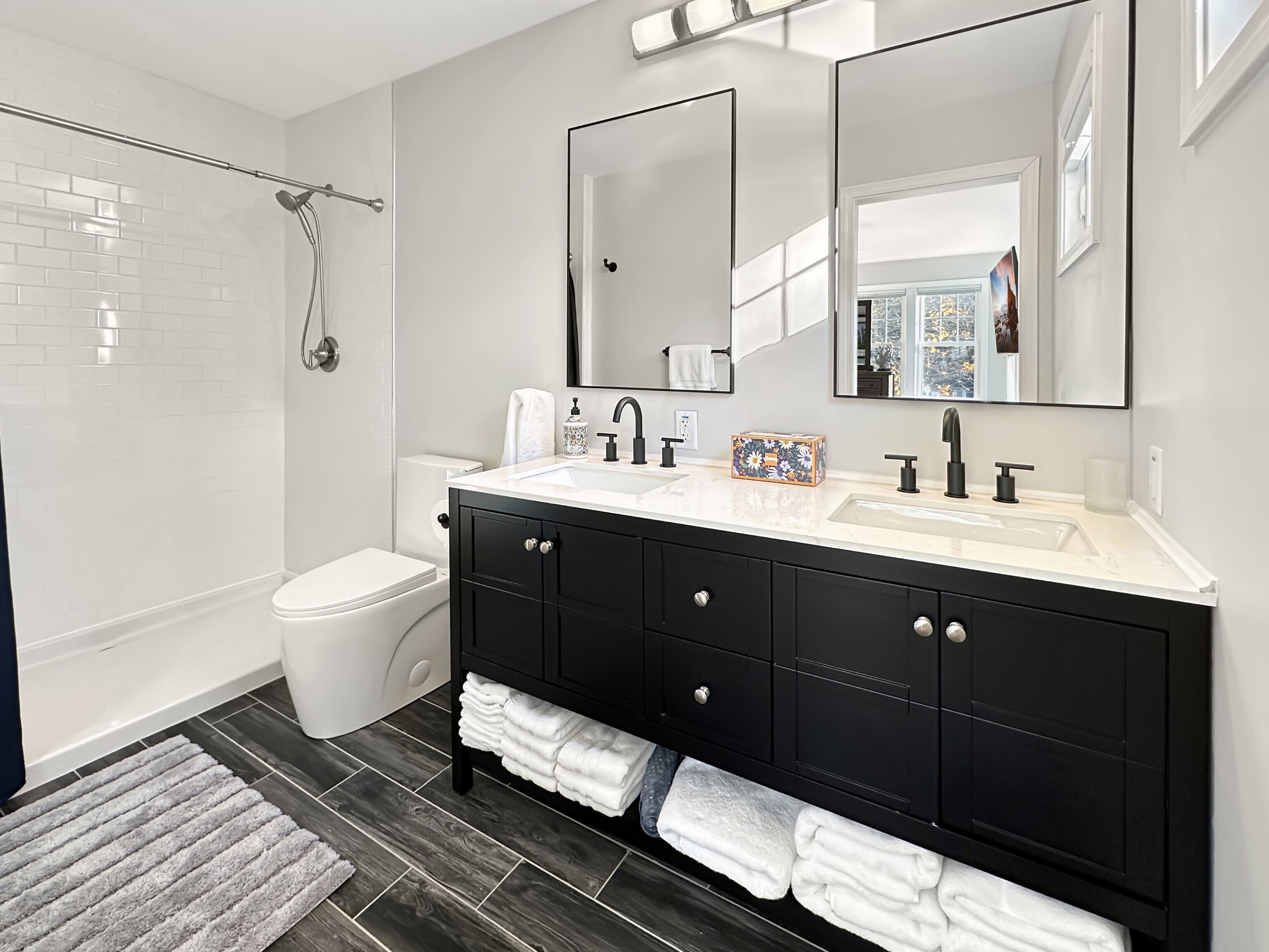 276 Niantic River Road Waterford, CT 06385 - Photo 30 of 40 a spacious bathroom with a double vanity sink toilet mirror and shower