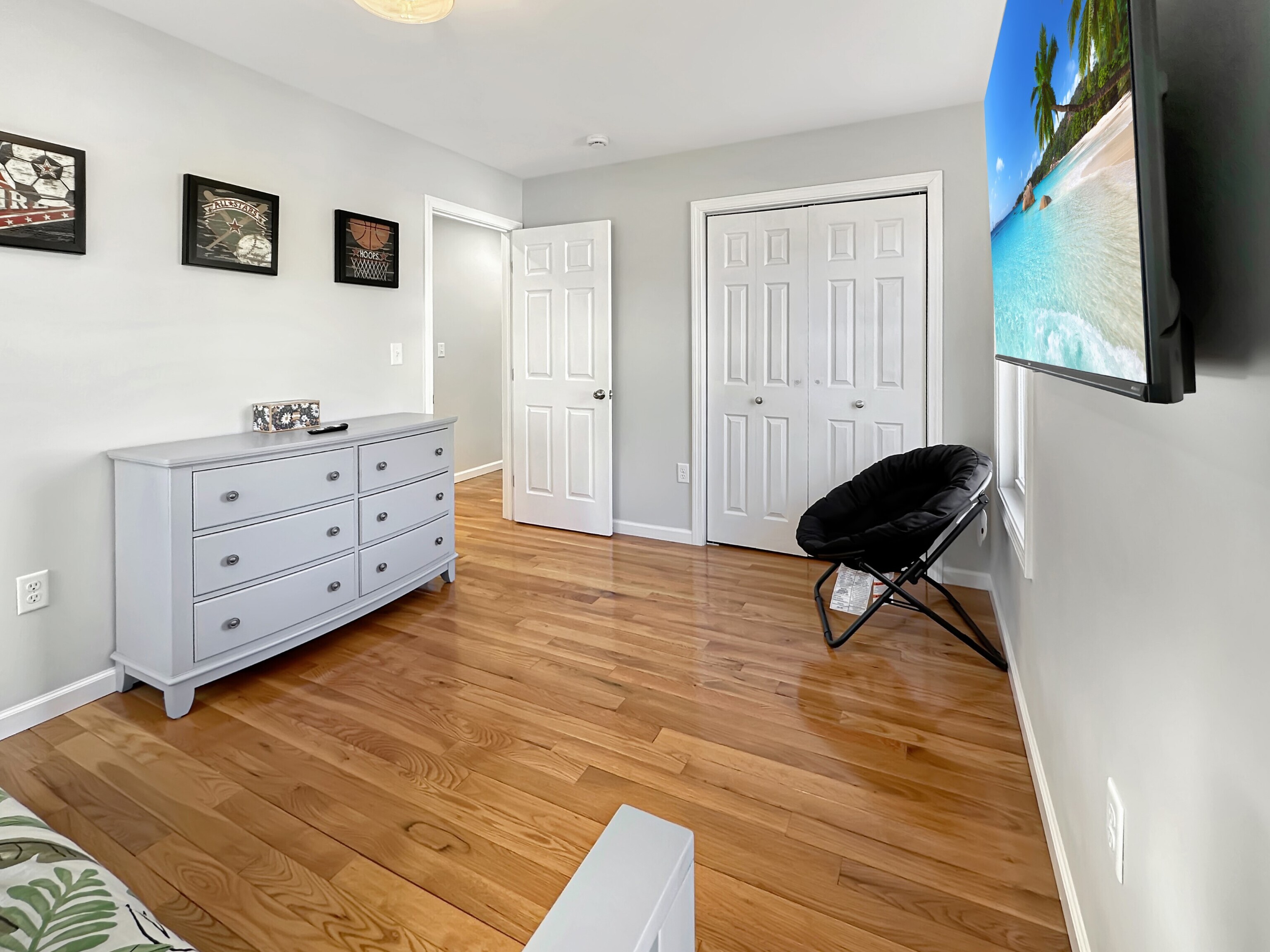 276 Niantic River Road Waterford, CT 06385 - Photo 32 of 40 a living room with furniture and a wooden floor