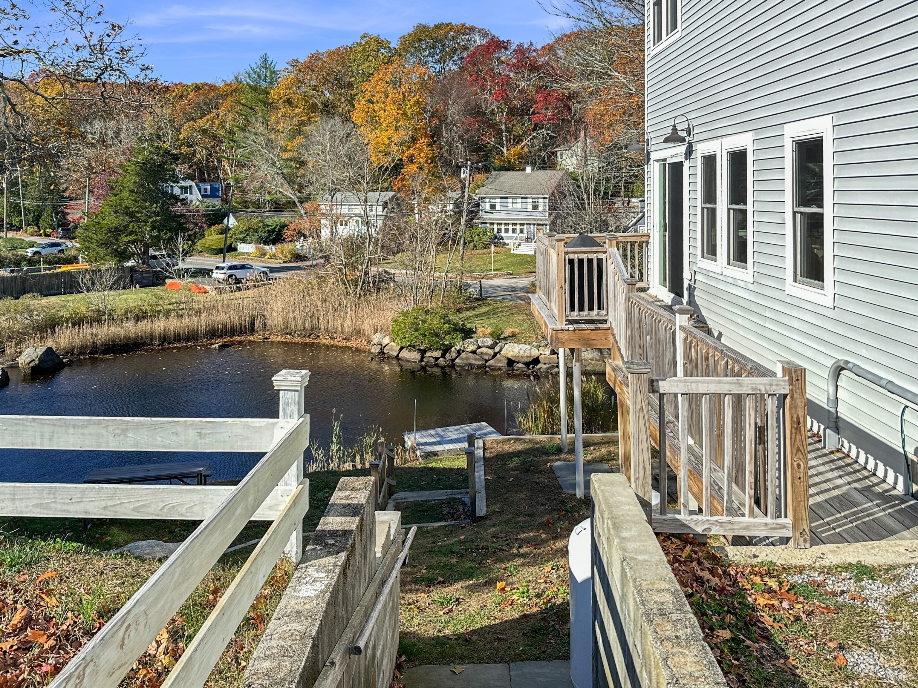 276 Niantic River Road Waterford, CT 06385 - Photo 4 of 40 a view of a balcony with two chairs and a table