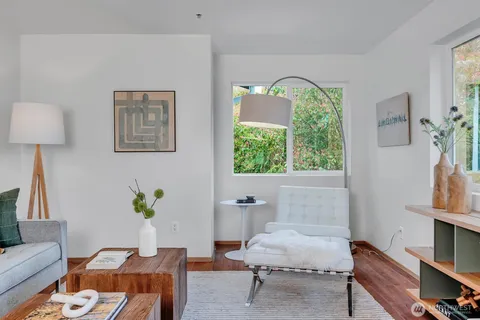 a living room with furniture and a window