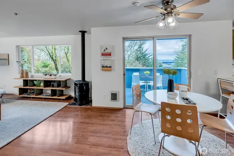 a view of a livingroom with furniture window and wooden floor