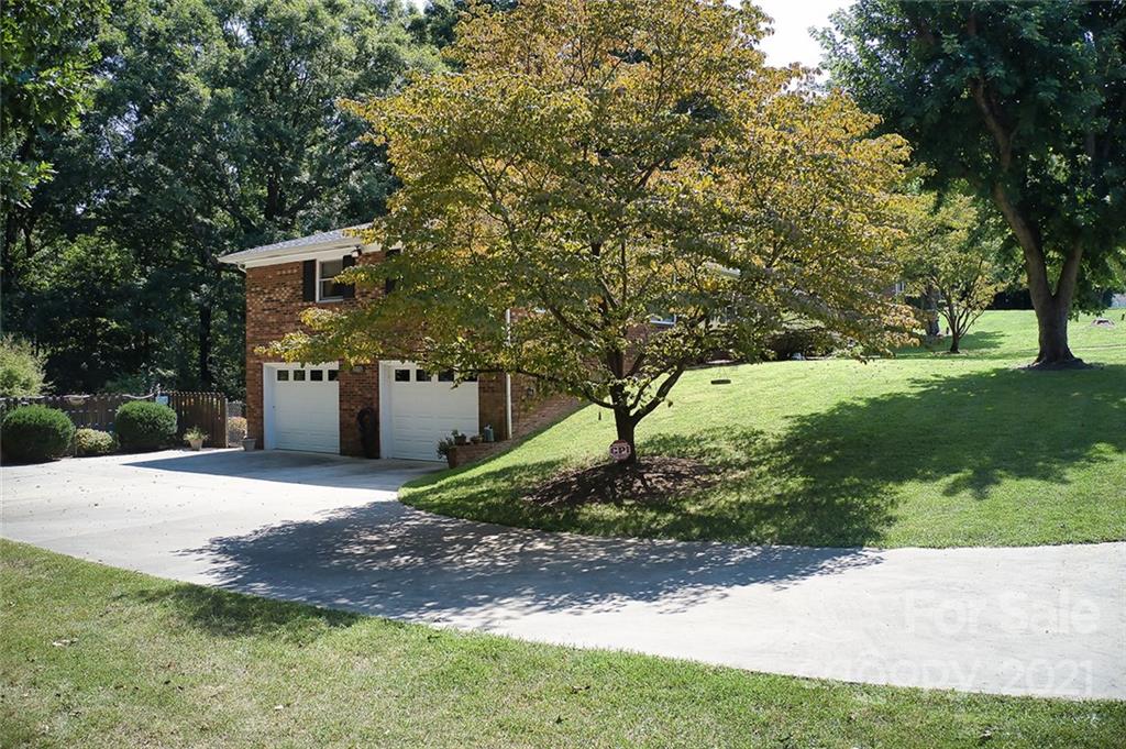 804 Hillside Street Southwest Valdese, NC 28690 - Photo 2 of 25 a front view of a house with a yard and garage