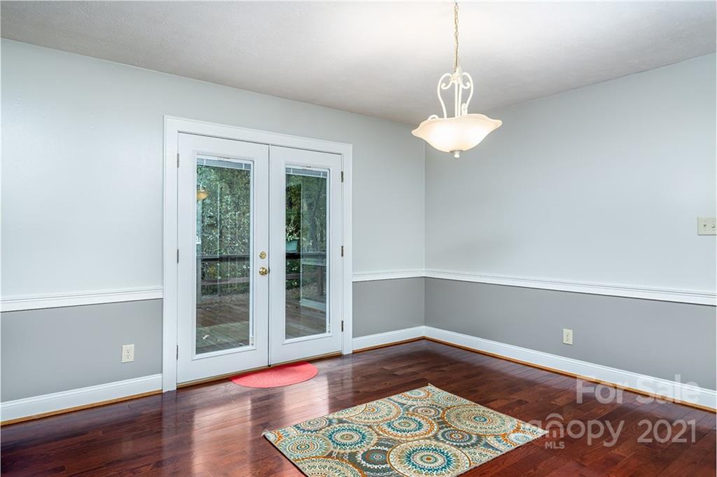 804 Hillside Street Southwest Valdese, NC 28690 - Photo 18 of 25 a view of a room with wooden floor and large windows