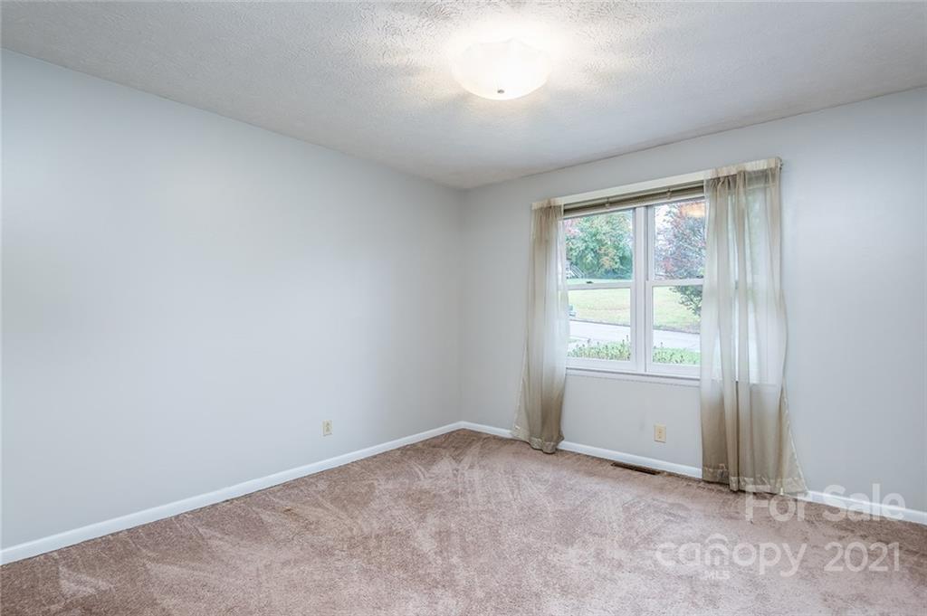 804 Hillside Street Southwest Valdese, NC 28690 - Photo 22 of 25 an empty room with windows