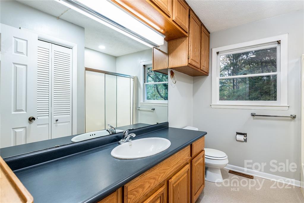 804 Hillside Street Southwest Valdese, NC 28690 - Photo 23 of 25 a bathroom with a sink double vanity and a toilet