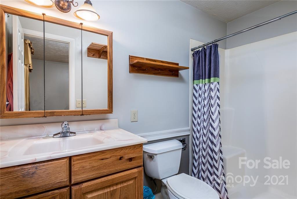 804 Hillside Street Southwest Valdese, NC 28690 - Photo 24 of 25 a bathroom with a sink toilet and shower