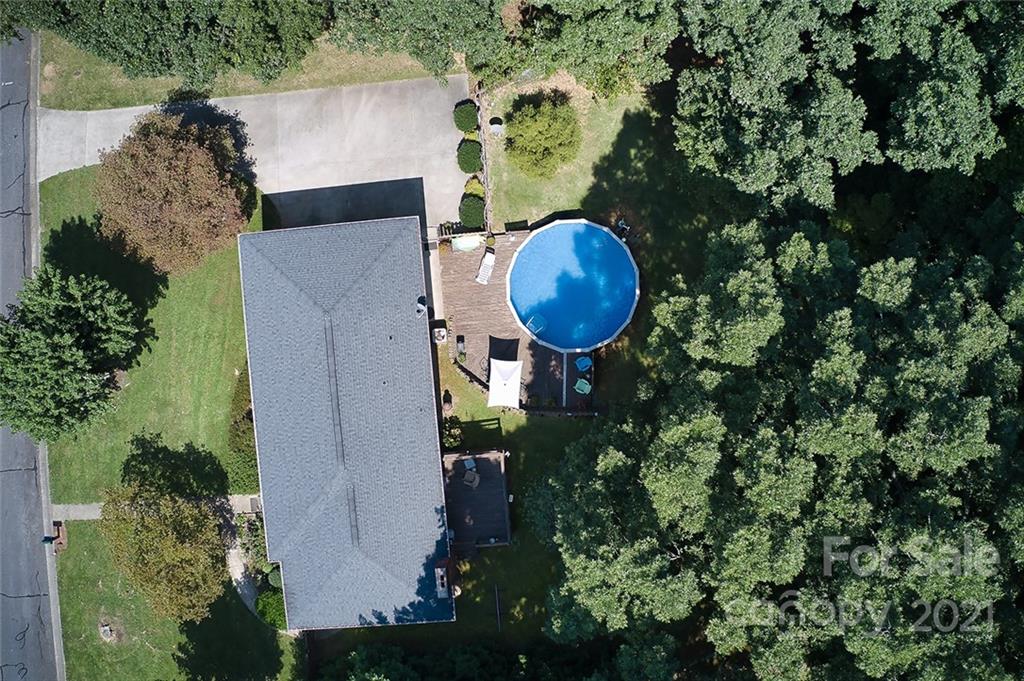 804 Hillside Street Southwest Valdese, NC 28690 - Photo 9 of 25 an aerial view of a house with a yard and swimming pool