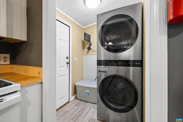 a view of a hallway with washer and dryer