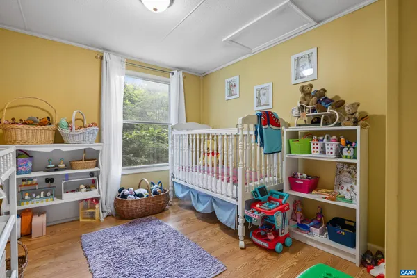 a room with toys and a wooden floor