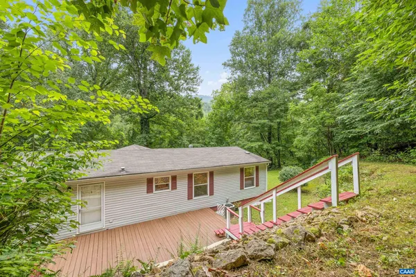 aerial view of a house with a yard