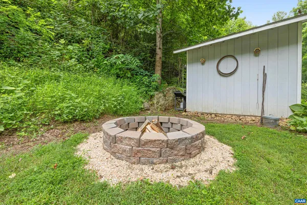 a view of yard with patio