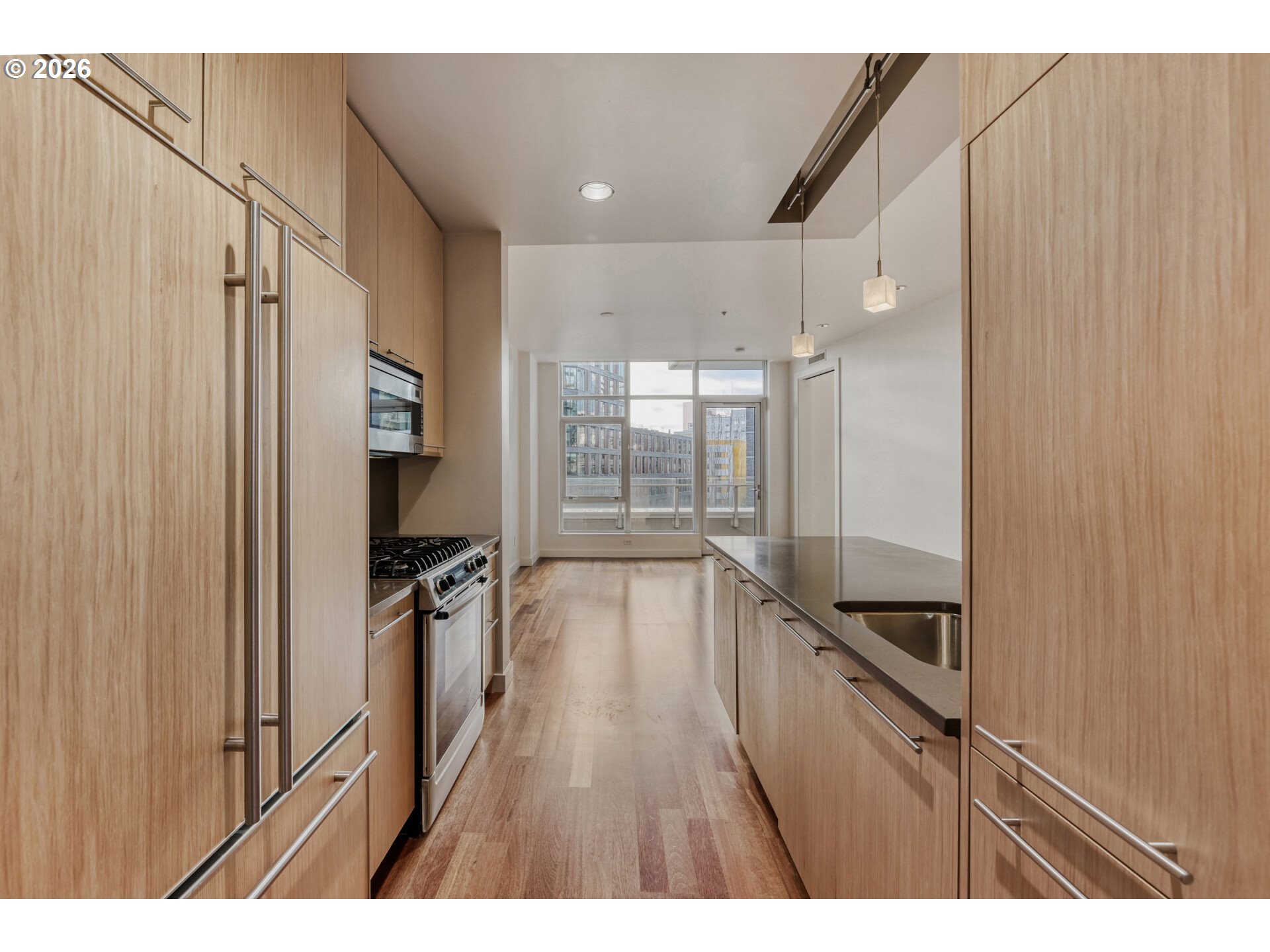 949 Northwest Overton Street, Unit 513 Portland, OR 97209 - Photo 16 of 35 a open kitchen with wooden floor