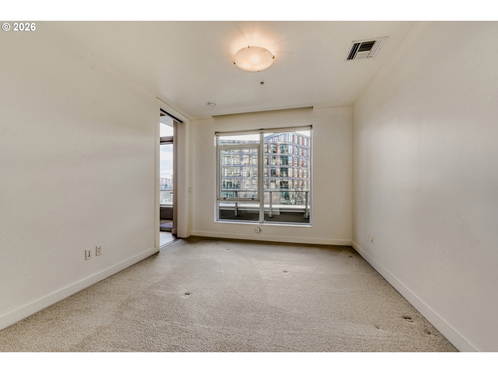 949 Northwest Overton Street, Unit 513 Portland, OR 97209 - Photo 20 of 35 a view of an empty room with a window