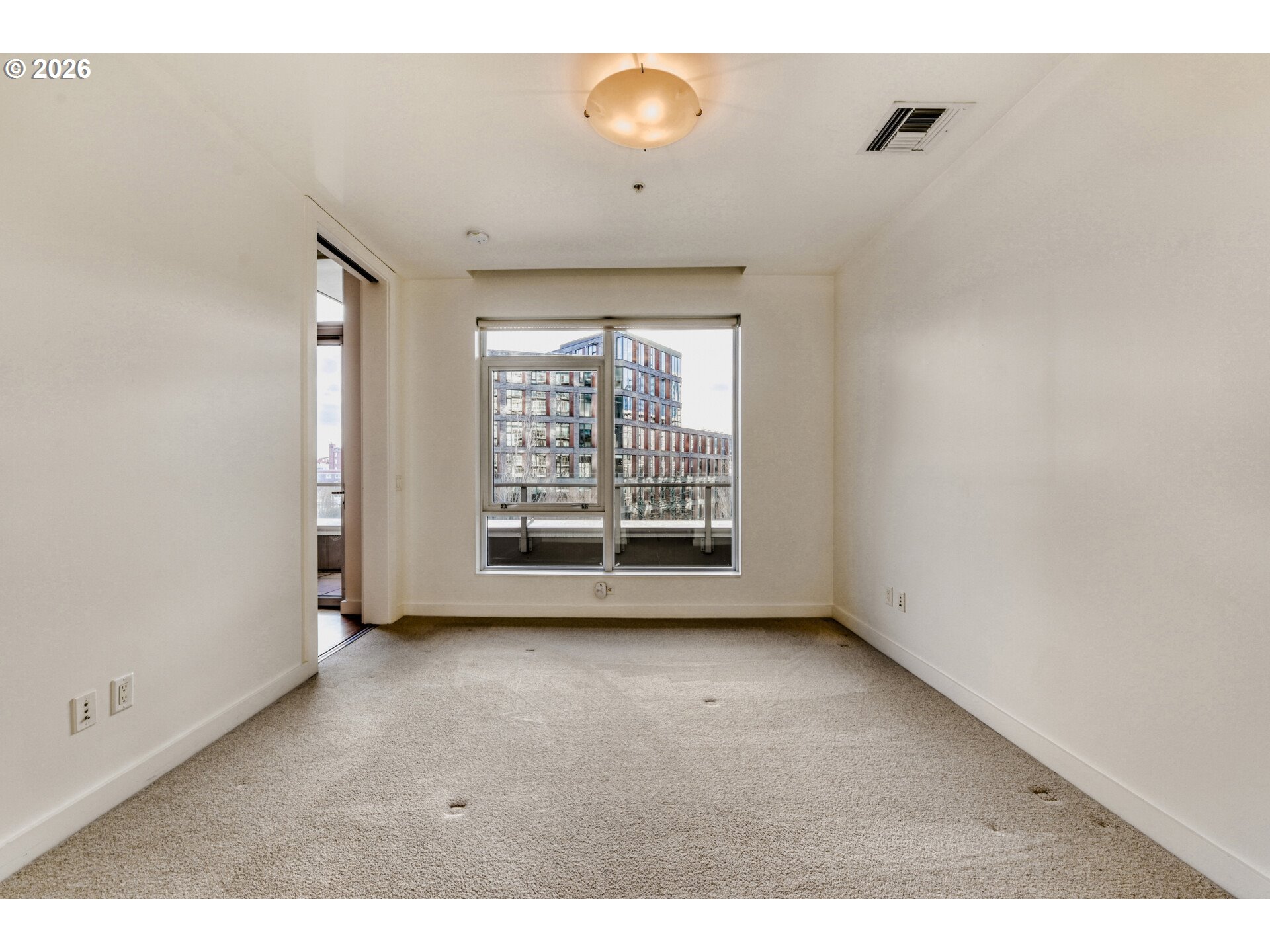 949 Northwest Overton Street, Unit 513 Portland, OR 97209 - Photo 21 of 35 a view of an empty room with a window
