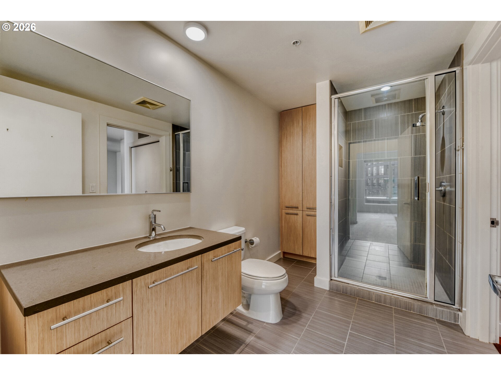 949 Northwest Overton Street, Unit 513 Portland, OR 97209 - Photo 23 of 35 a bathroom with a sink a toilet and shower