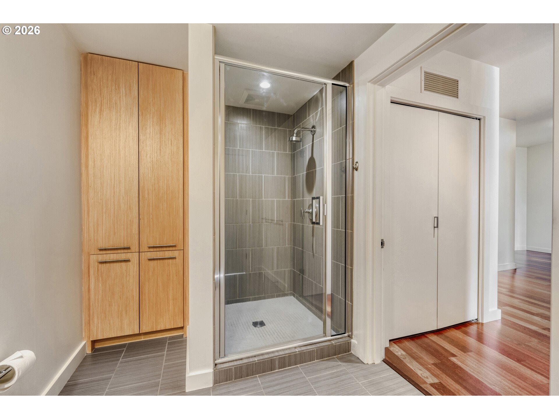 949 Northwest Overton Street, Unit 513 Portland, OR 97209 - Photo 25 of 35 a bathroom with a glass shower door