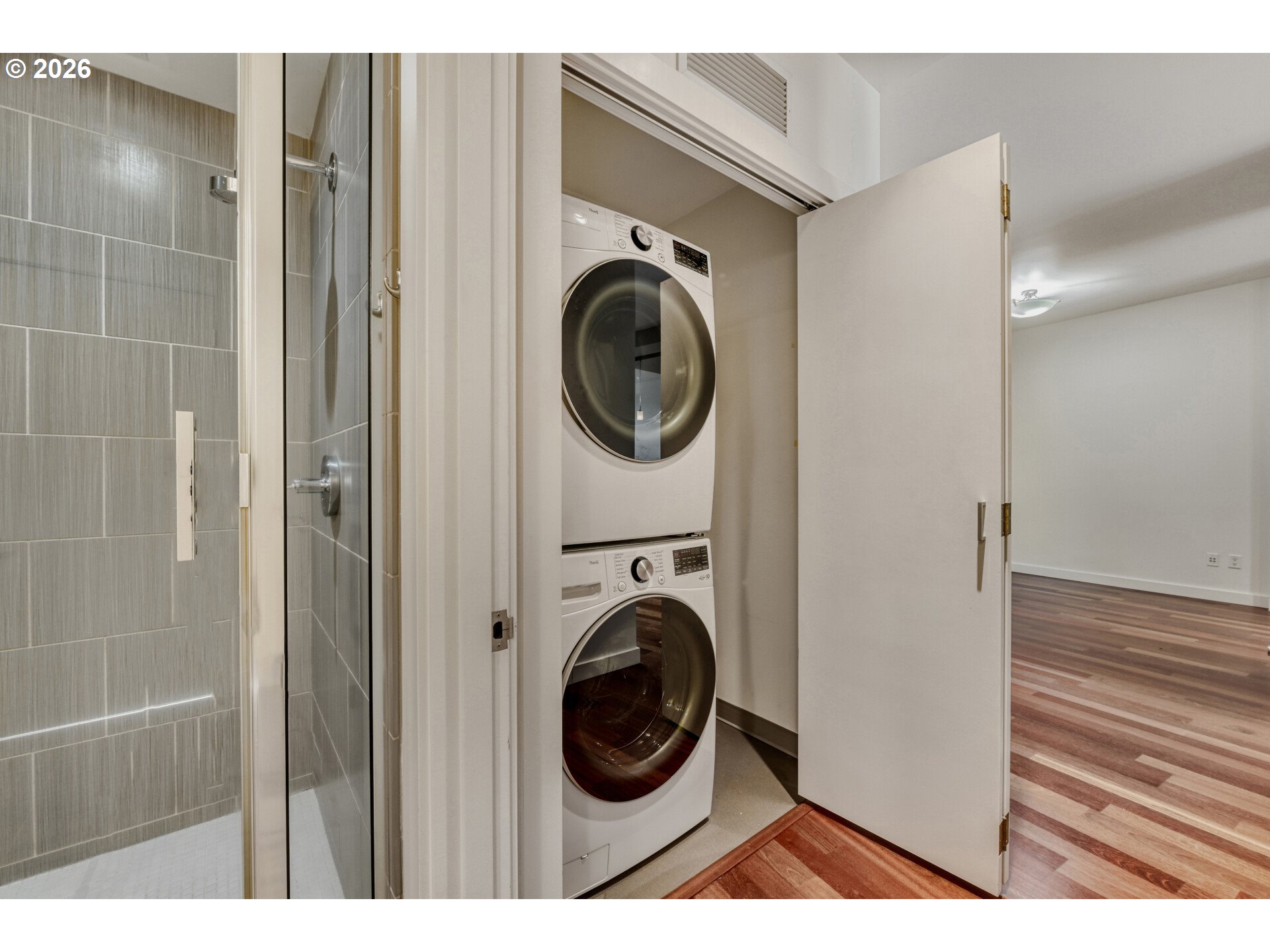 949 Northwest Overton Street, Unit 513 Portland, OR 97209 - Photo 26 of 35 a view of a hallway with washer and dryer