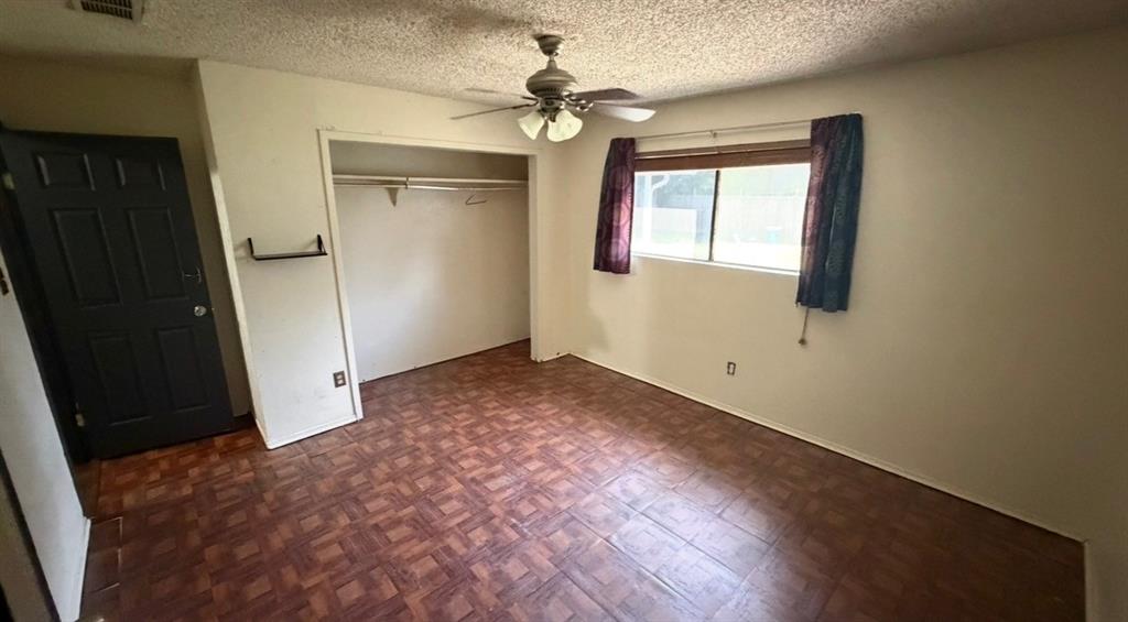 812 Reveille Road Fort Worth, TX 76108 - Photo 6 of 22 Room featuring patterned flooring, a ceiling fan, and a single window with blinds