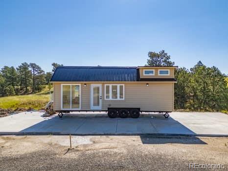 32147 Waylongood Point Kiowa, CO 80117 - Photo 7 of 19 a view of a house with a yard