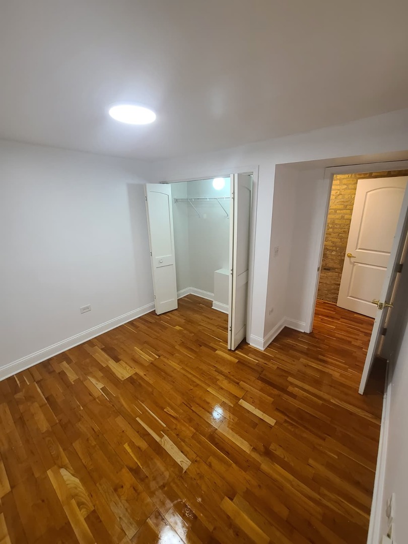 4944 North Spaulding Avenue, Unit G Chicago, IL 60625 - Photo 9 of 9 a view of a room with wooden floor