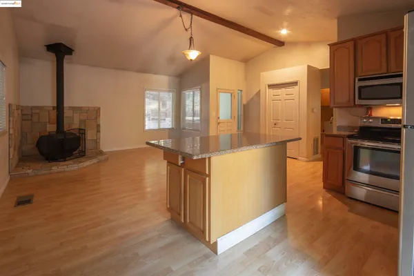 a kitchen with stainless steel appliances a refrigerator and a stove