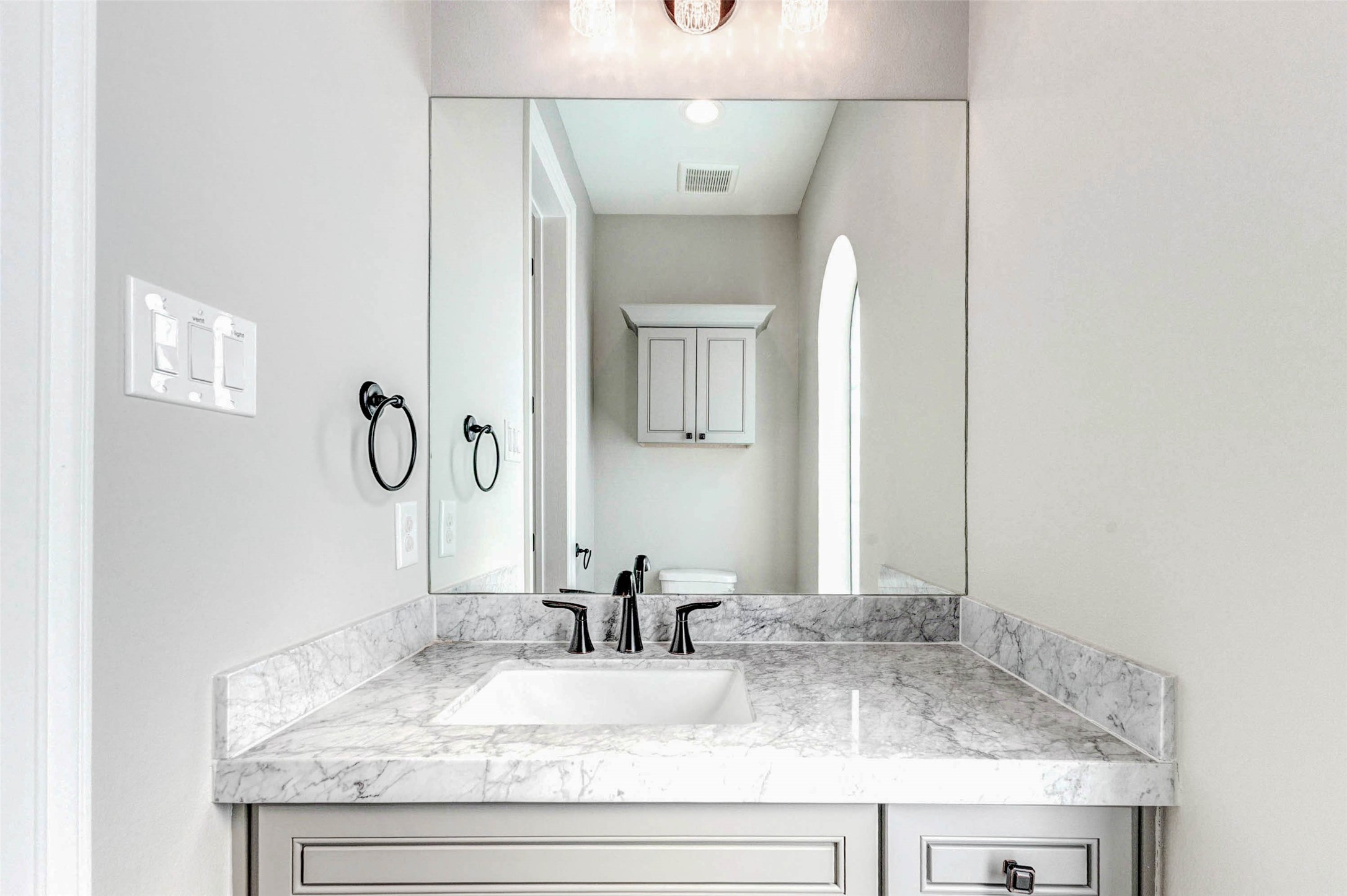 2771 Freund Street Houston, TX 77003 - Photo 11 of 25 a bathroom with a granite countertop sink and a mirror