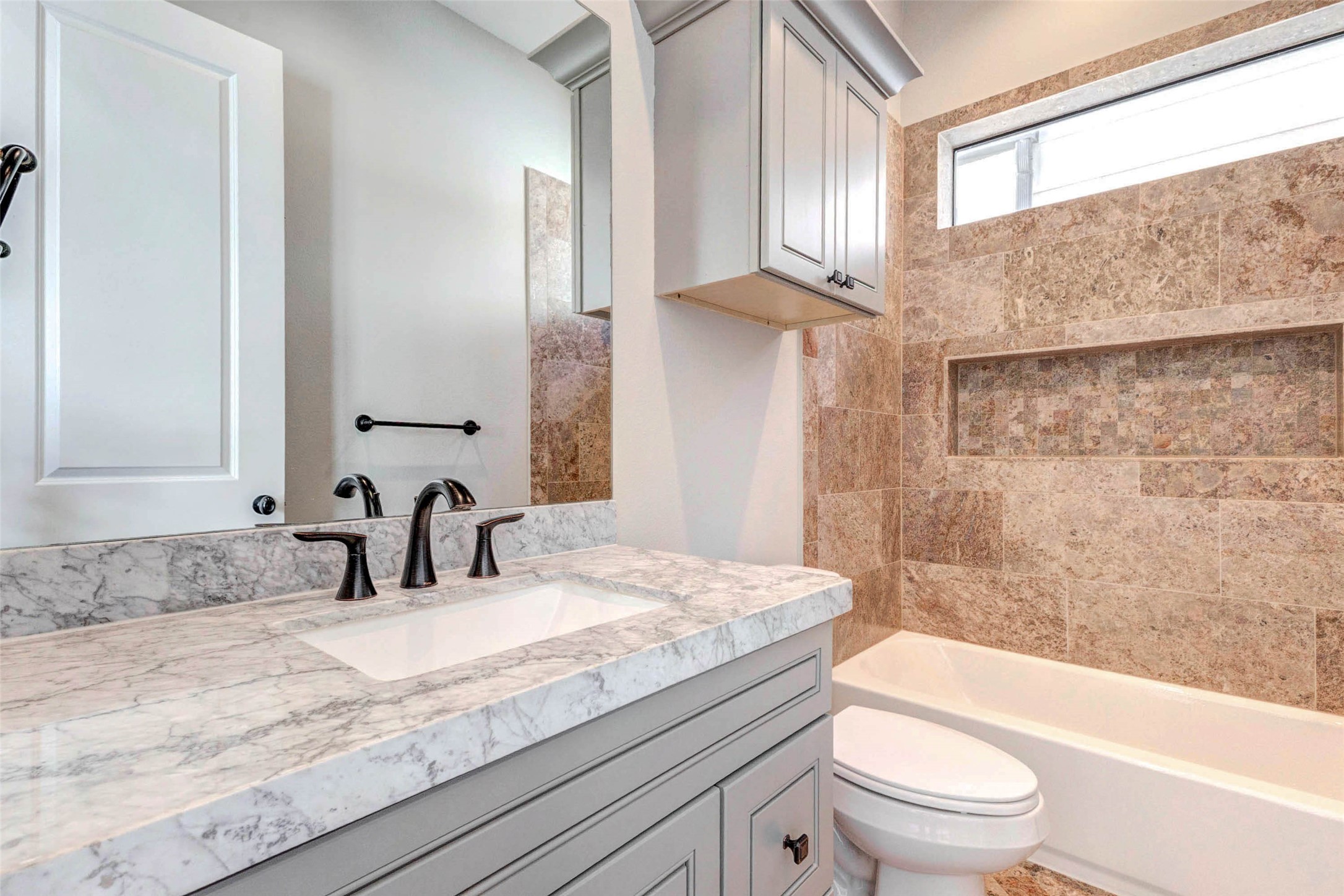 2771 Freund Street Houston, TX 77003 - Photo 14 of 25 a bathroom with a granite countertop bathtub shower sink vanity mirror and toilet