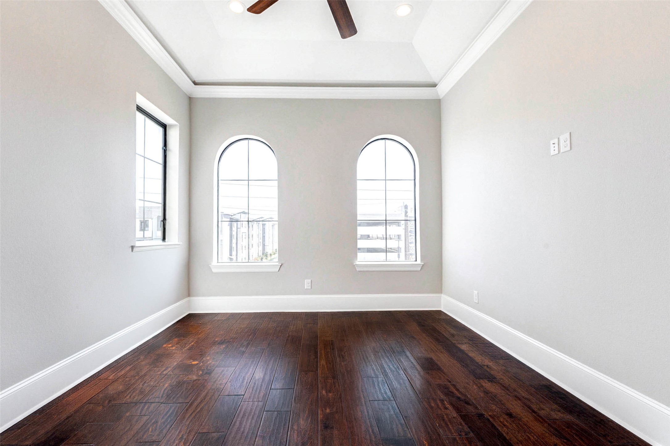 2771 Freund Street Houston, TX 77003 - Photo 15 of 25 an empty room with wooden floor and windows
