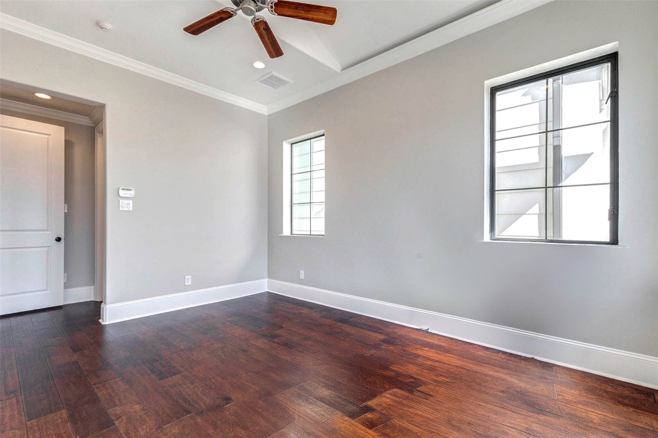 2771 Freund Street Houston, TX 77003 - Photo 16 of 25 a view of an empty room with wooden floor and a window