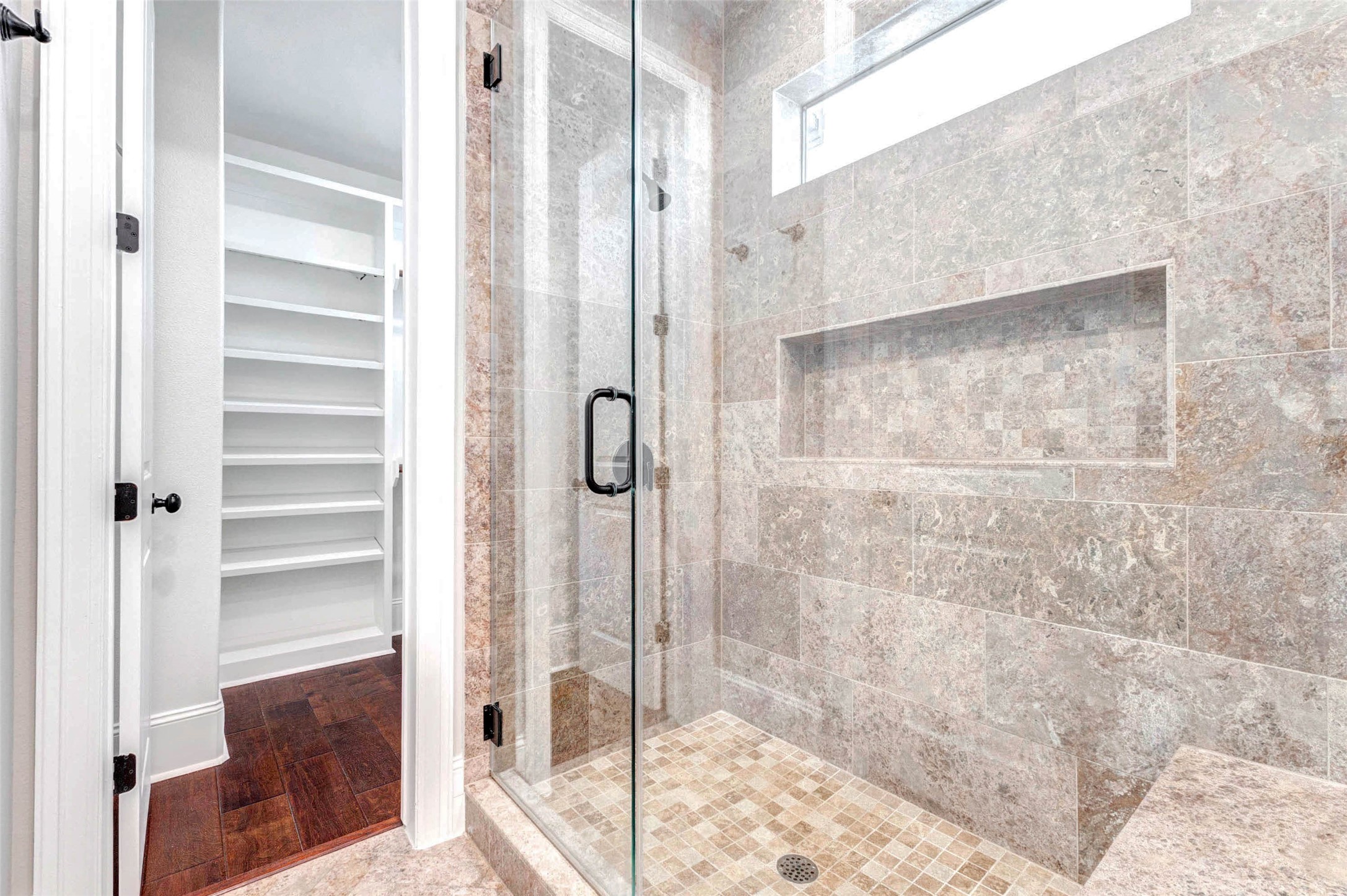 2771 Freund Street Houston, TX 77003 - Photo 19 of 25 a bathroom with a shower and a glass door