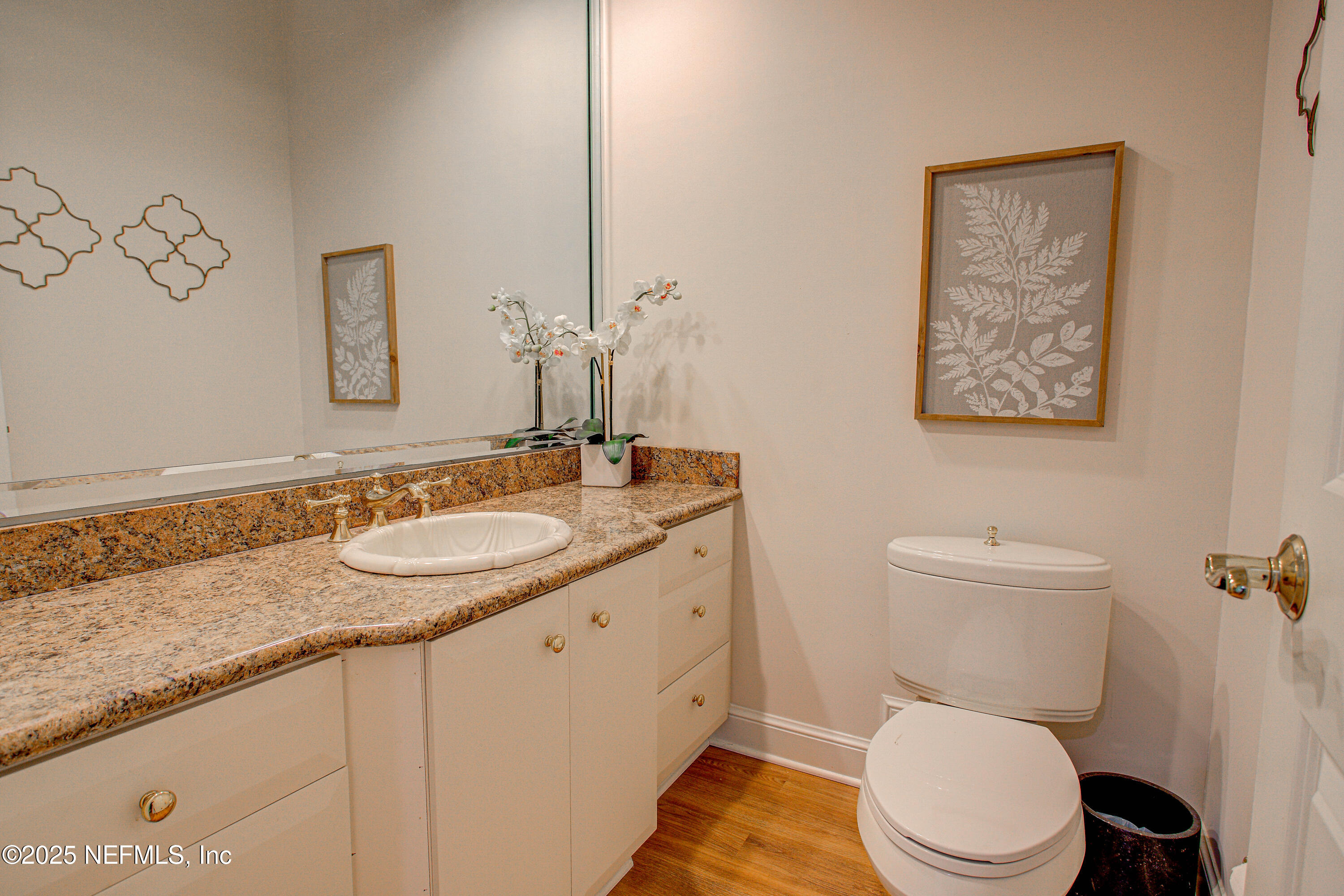 9155 June Lane St. Augustine, FL 32080 - Photo 20 of 43 a bathroom with a granite countertop sink and a mirror