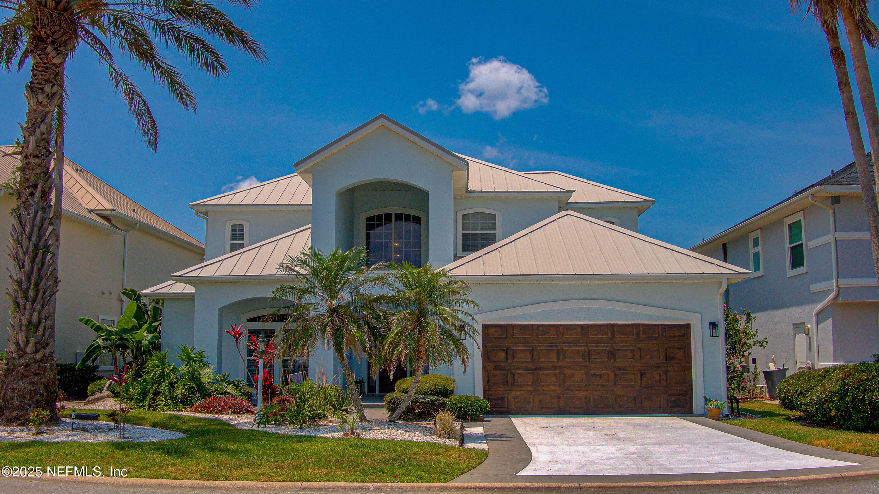 9155 June Lane St. Augustine, FL 32080 - Photo 2 of 43 a front view of a house with a yard
