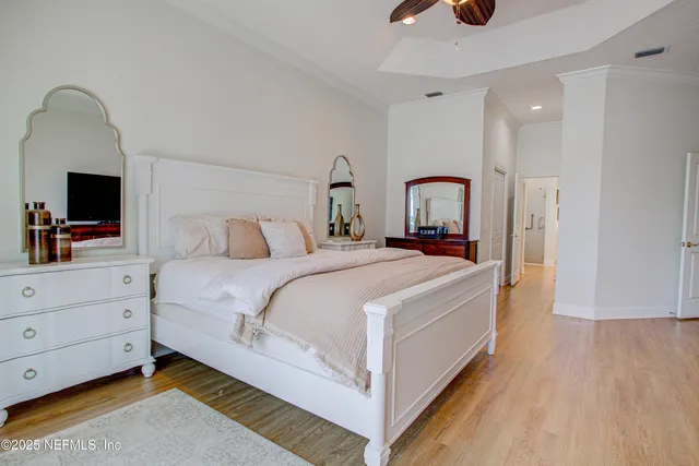 a spacious bathroom with a granite countertop sink mirror and shower