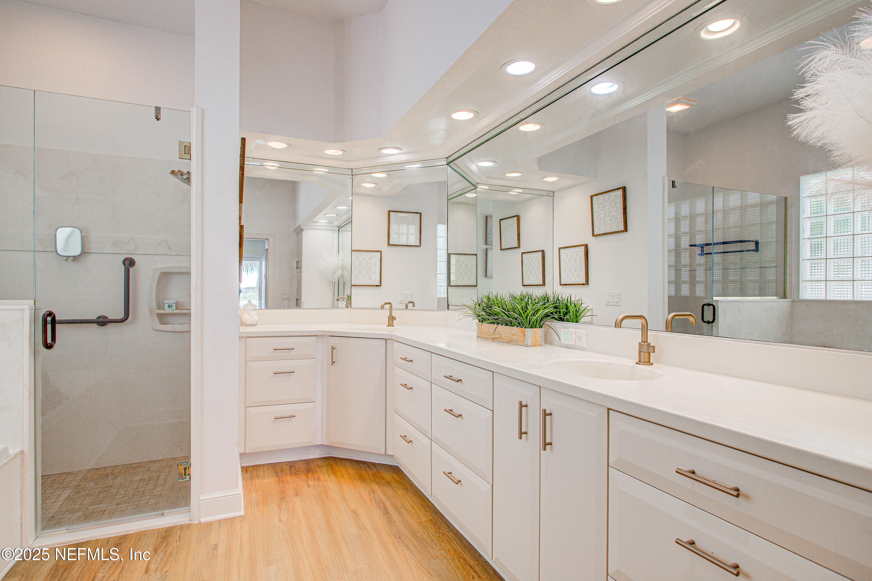 9155 June Lane St. Augustine, FL 32080 - Photo 24 of 43 a spacious bathroom with a granite countertop sink mirror and shower