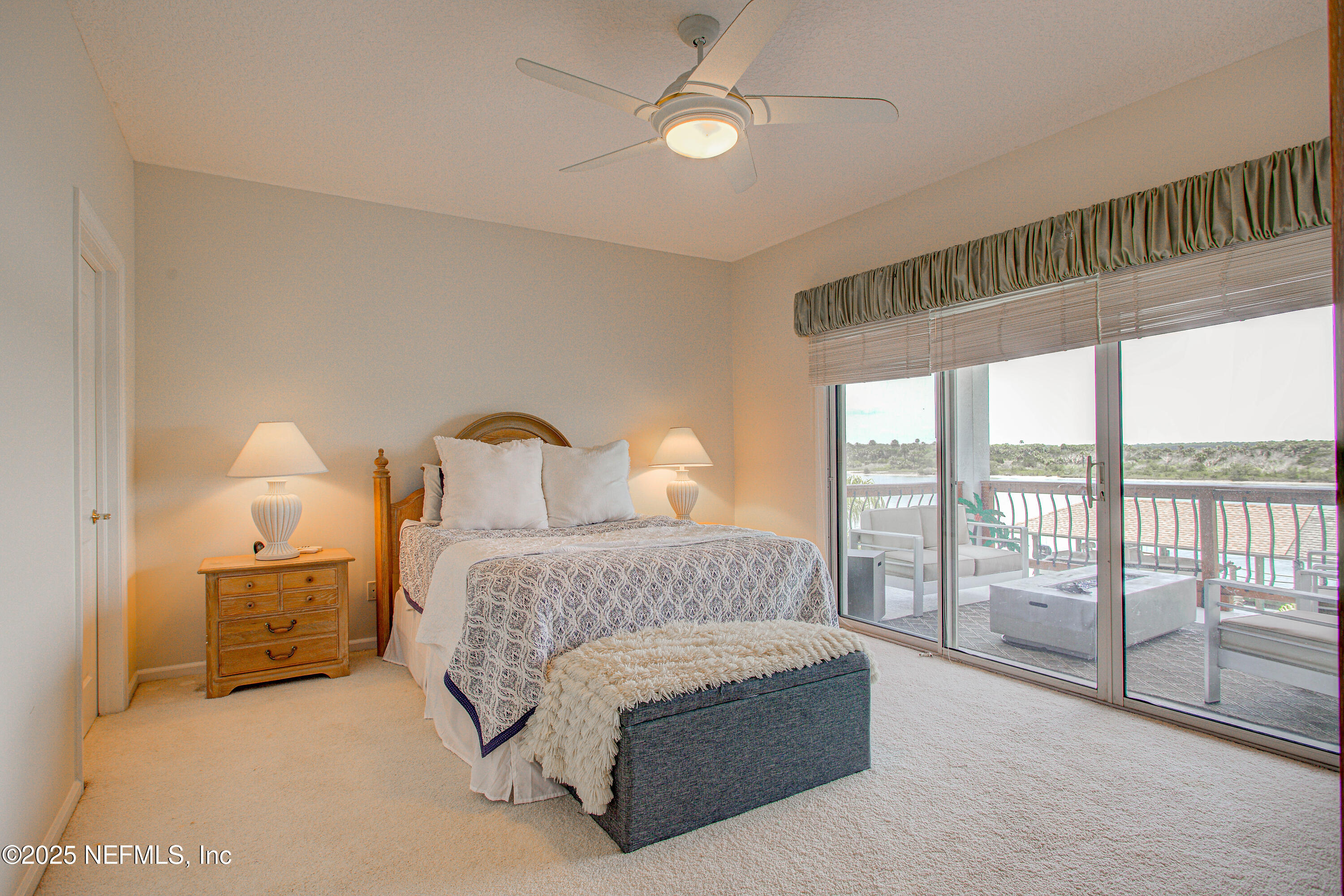 9155 June Lane St. Augustine, FL 32080 - Photo 33 of 43 a spacious bedroom with a bed and a large window