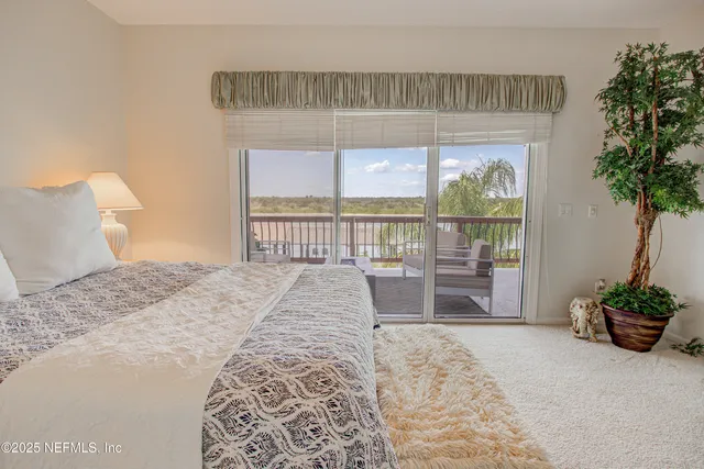 a view of a balcony with furniture